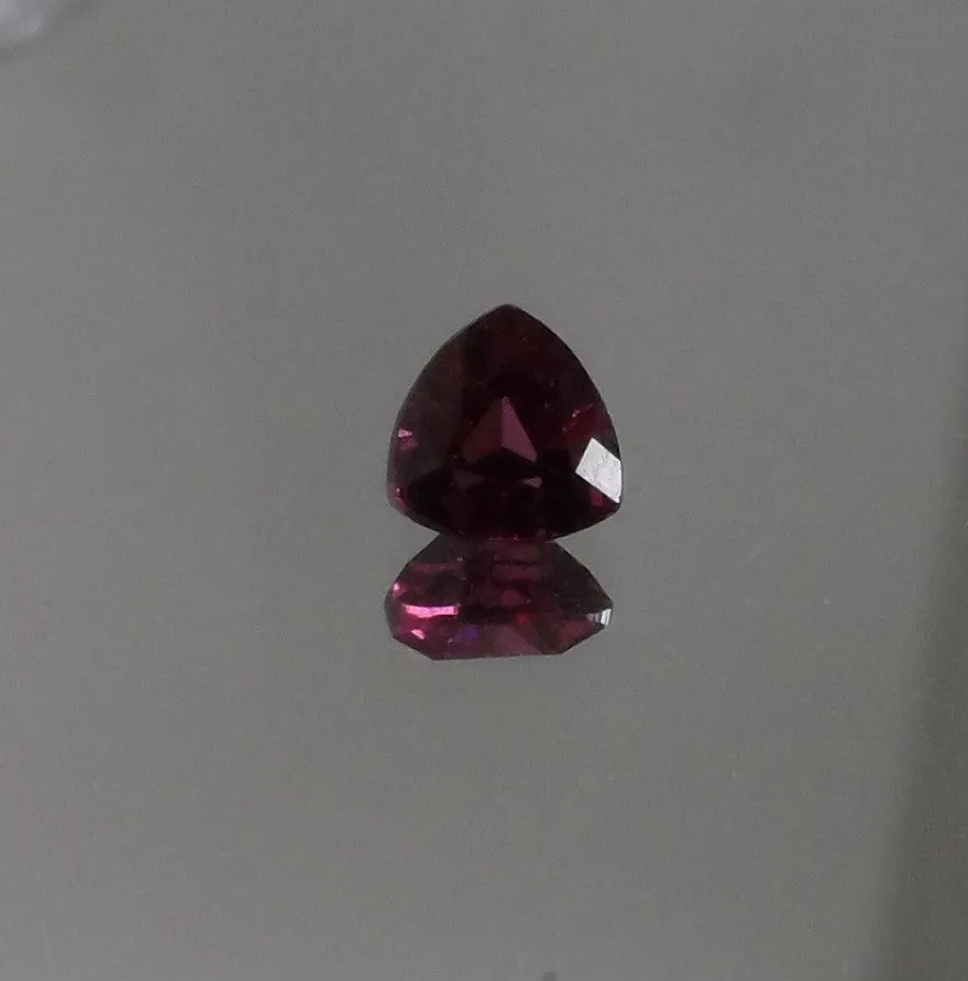 .75 CT. SPARKLING DARK PINK/PURPLE COLOR TRILLIAN CUT GARNET