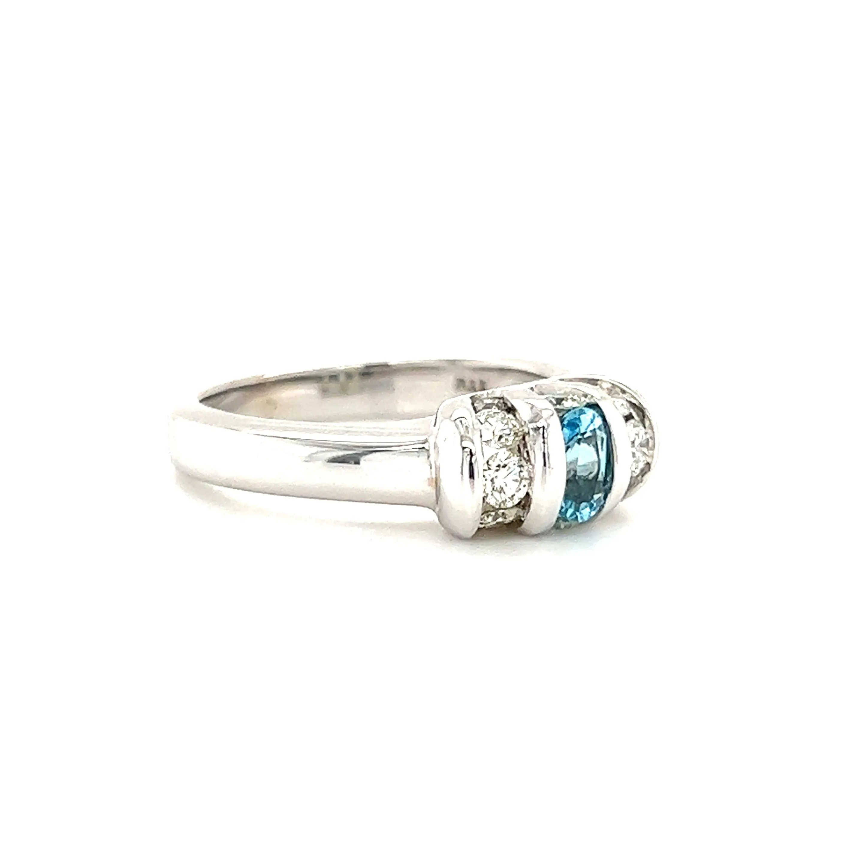 Oval Blue Topaz Ring with Side Diamonds in 14K White Gold