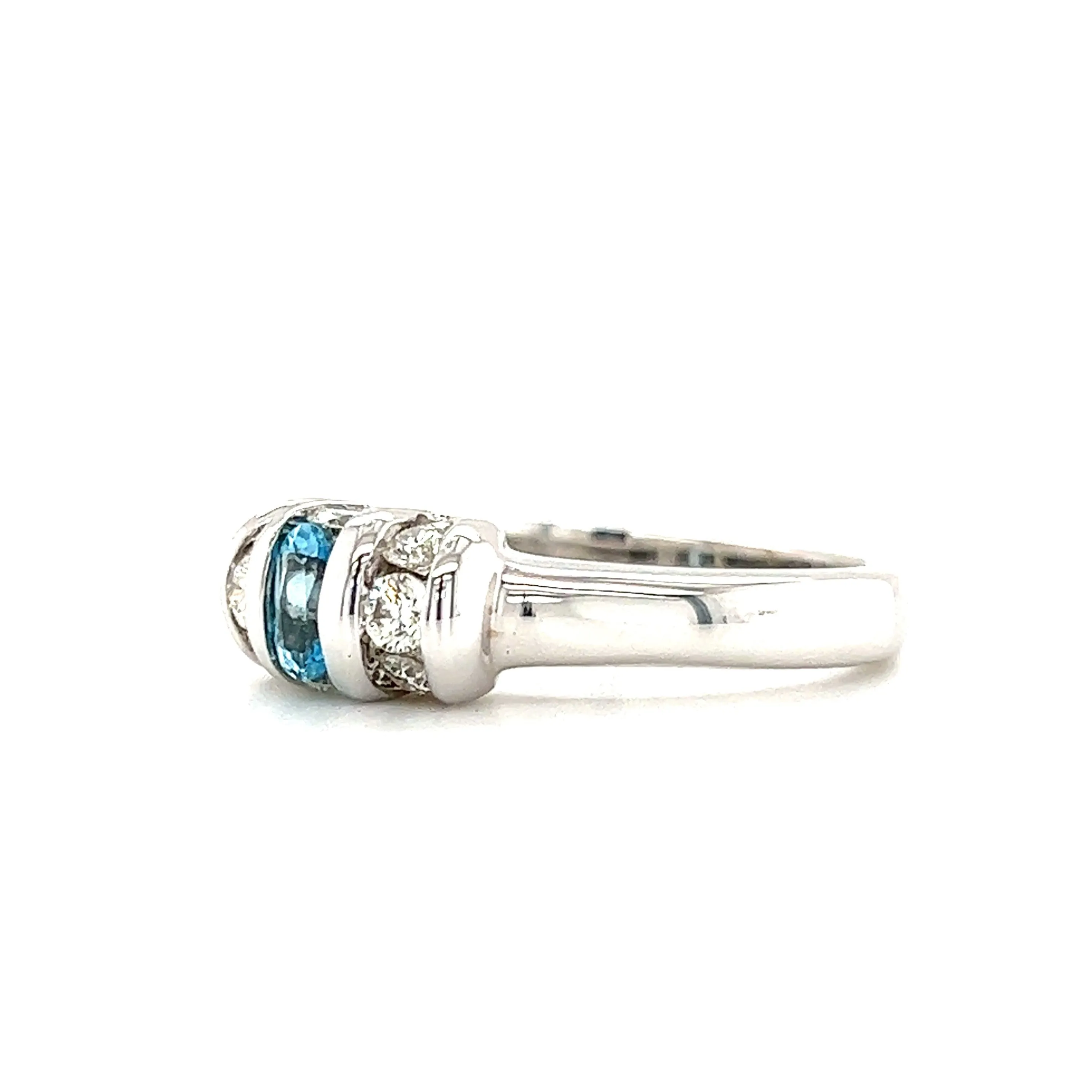 Oval Blue Topaz Ring with Side Diamonds in 14K White Gold